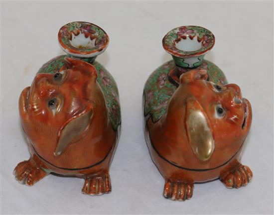 A pair of Chinese export enamelled porcelain Buddhist lion vases, mid 19th century, length 12.5cm